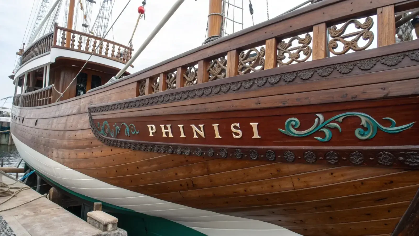 Carved and painted detail on the stern of a finished wooden phinisi